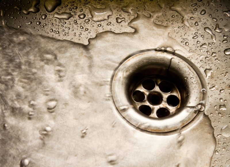 Water running down the drain, deep sinkhole
